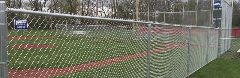 Chain link backstop fence at a baseball field